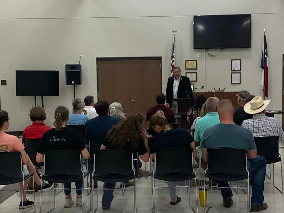 A speaker addressing a seated audience at a Montague County Republican Party meeting